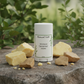 Deodorant with shea and cocoa butter on rock